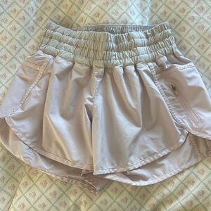 Lululemon shiny light pink + white shorts